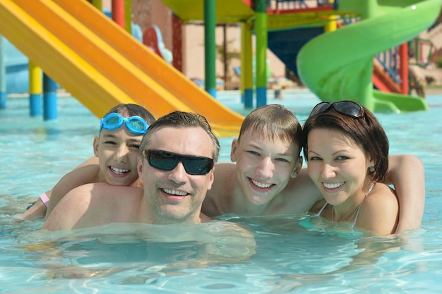 Family relaxing in the pool