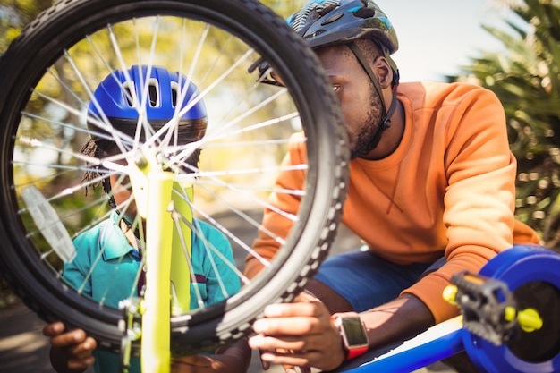 Family repairing a bike