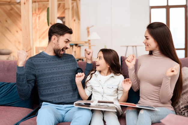 Family sit and rejoice that they chose color for furniture