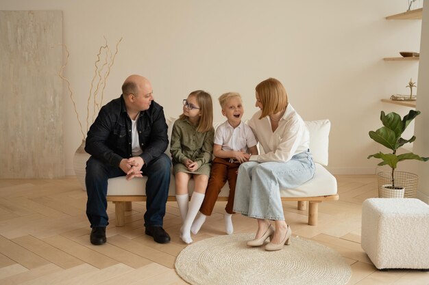 The family sitting on the sofa at home