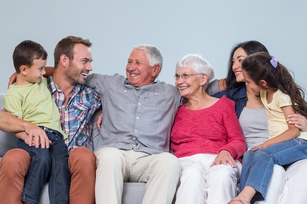 Family sitting on sofa