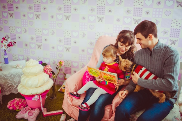 Family sitting on a sofa