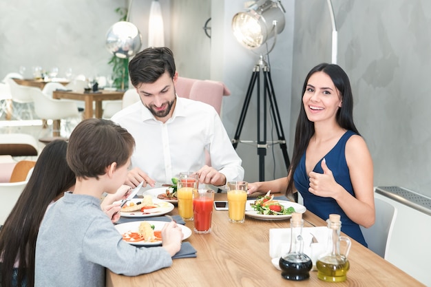 Family sitting together in the restaurant lunch concept