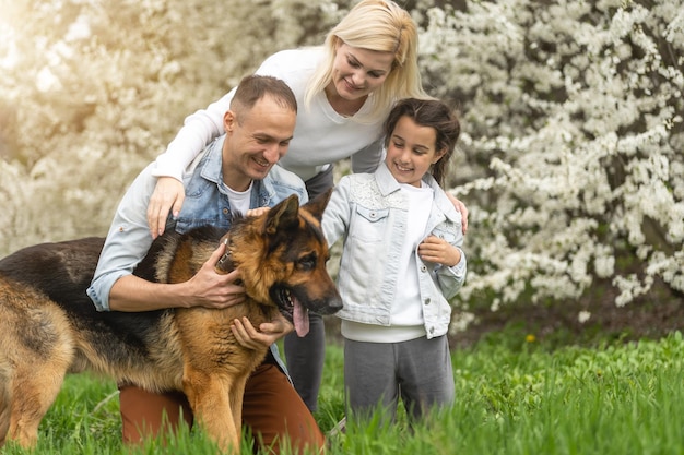 Family and small child outdoors in spring nature, resting.