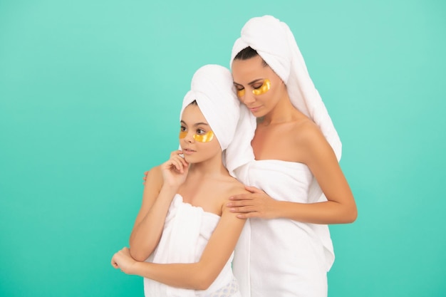 Family spa of mother and daughter with collagen patch