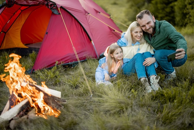 Family spend summer time at campsite while travel