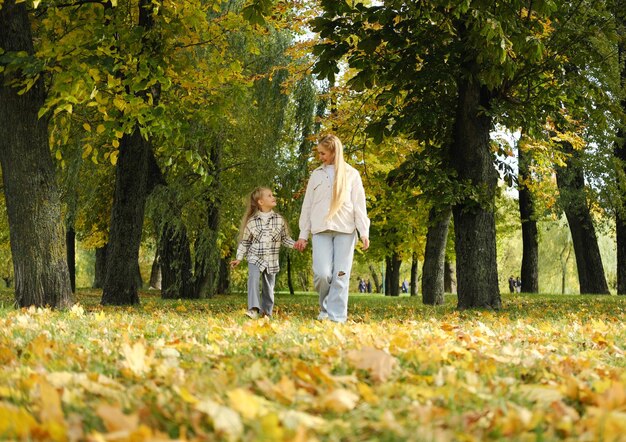 Family spend time together in autumn park