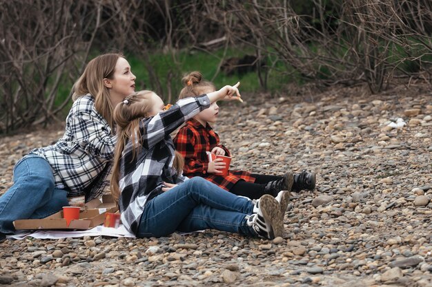 the family spends time on a weekend outside the city on a picnic