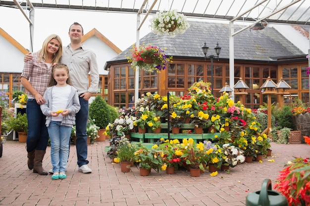 Family standing in the garden center