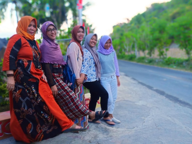 Family standing at roadside