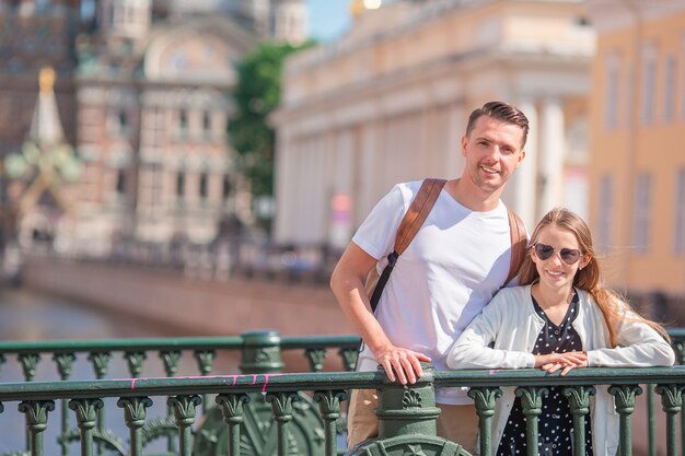 Family at the summer waterfront in Saint Petersburg outdoors