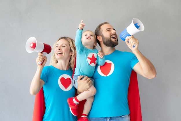 Family of superheroes playing at home