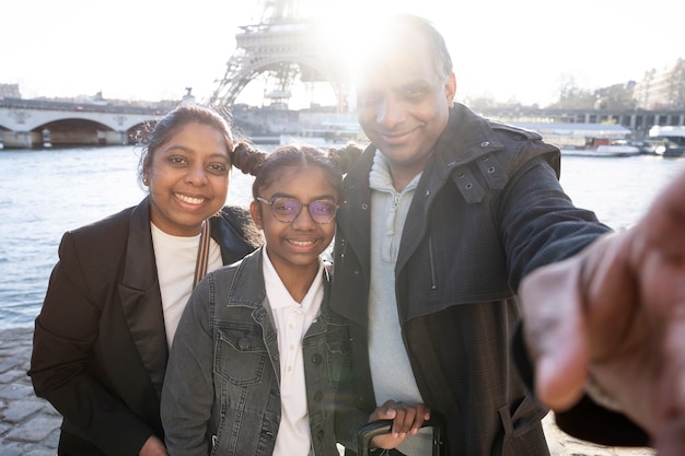 Family taking a picture in their travel to paris