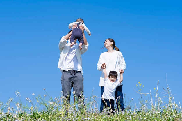 A family taking a walk while having fun on fine day