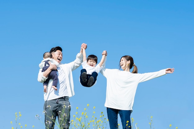 A family taking a walk while having fun on fine day