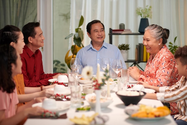 Family talking at dinner table