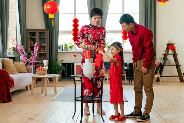 Family of three preparing for chinese new year