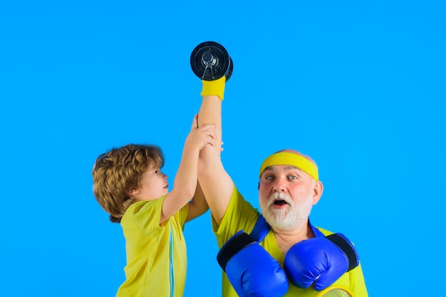 Family time grandfather and kid sporting family sport old man with dumbbells portrait of healthy