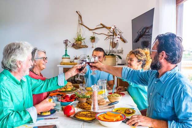 Family toasting drinks while sitting at home