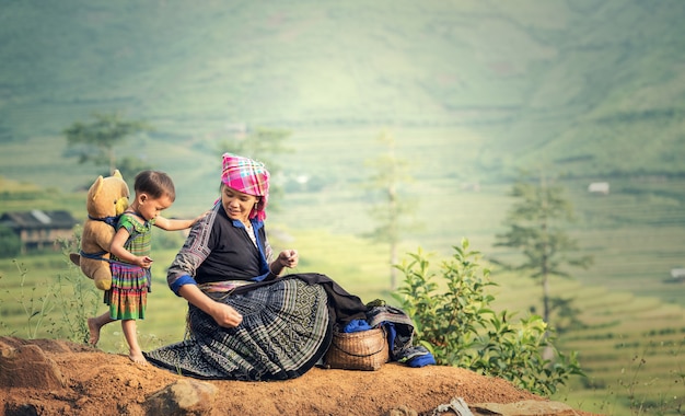 Family tribal mother and daughter in rice terraces, Tu Le Lao Cai, Vietnam