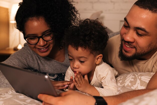 Family using digital tablet at home