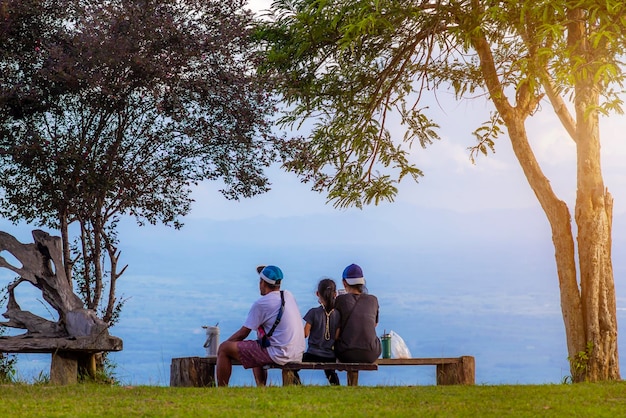 Family vacation concept Family lifestyle and happiness in nature A family with father mother and children who are happy together