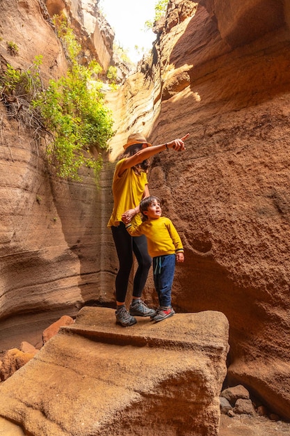 Family on vacation enjoying in the limestone canyon barranco de las vacas in gran canaria canary islands