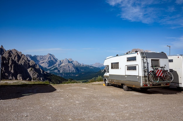 Family vacation travel, holiday trip in motorhome, VR Caravan car Vacation. Beautiful Nature Italy natural landscape Alps. National Nature Park Tre Cime In the Dolomites