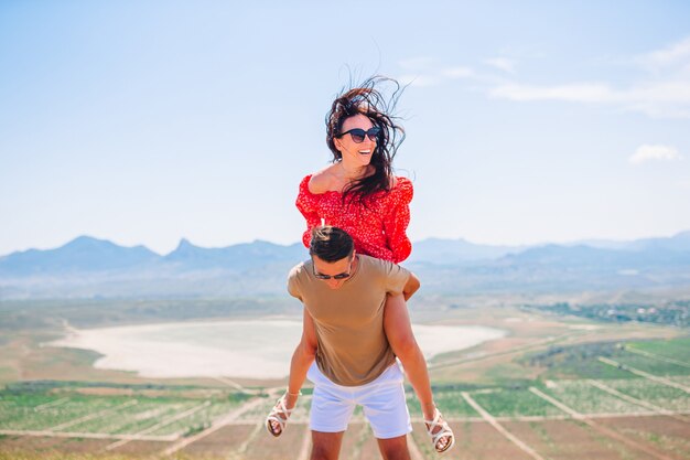 Family vacation. Young couple enjoy time together with beautiful landscape