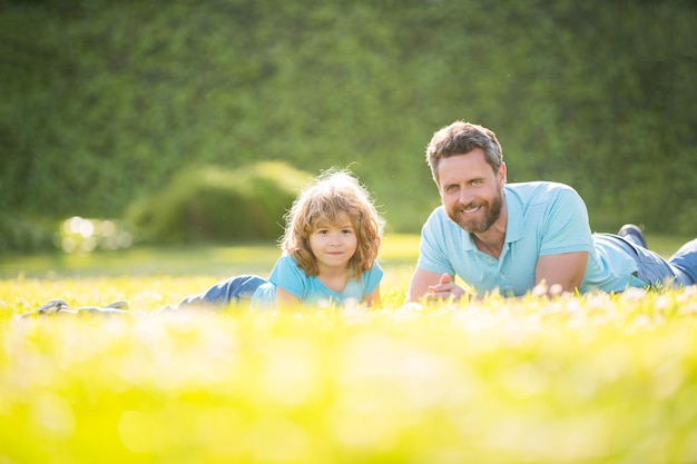 Family value childhood and parenthood parent relax with little child boy on grass