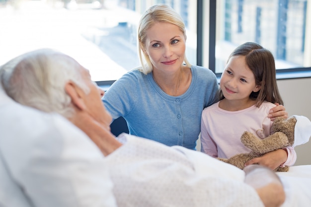 Family visiting senior patient