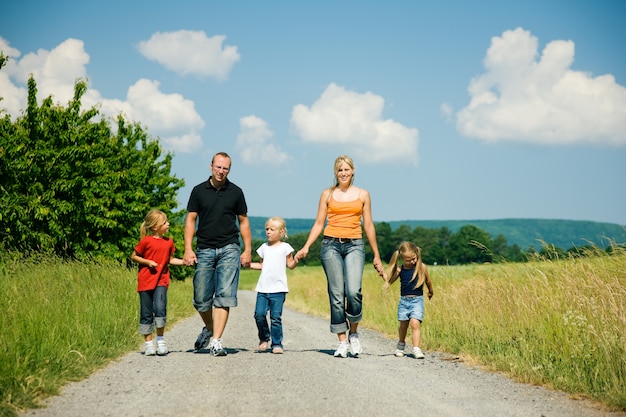 family walking down a path