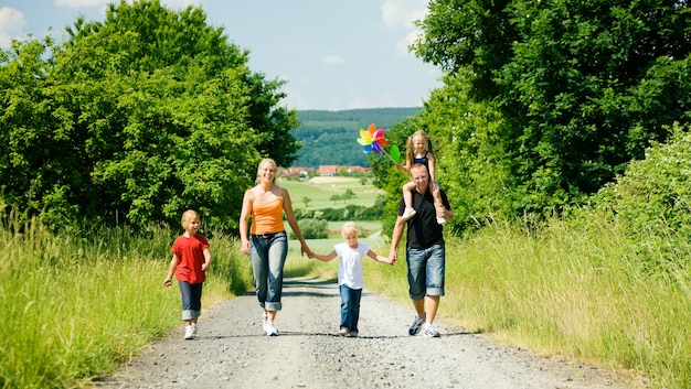 family walking down a path