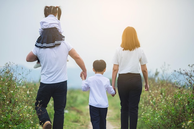 A family walking hand in hand outdoors,Happy family atmosphere