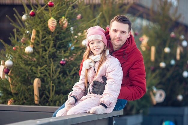 Family winter sport. Father and daughter on winter day