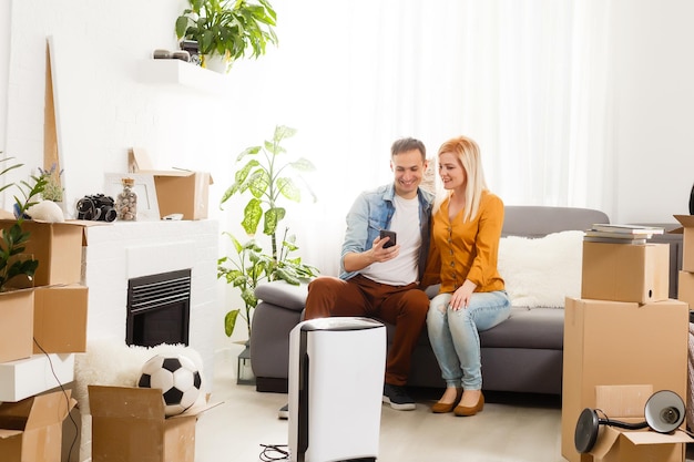 family with an air purifier moving to a new apartment