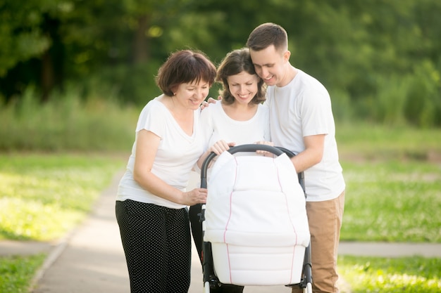 Photo family with a baby stroller