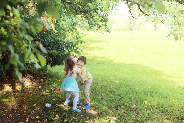 Family with children for a walk in the summer park. Ð¡oming autumnÂ in the park. Family. Fall. Happiness.