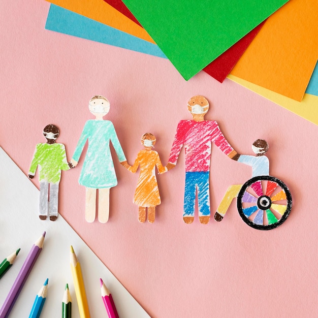 Photo family with disables person in cutout paper top view