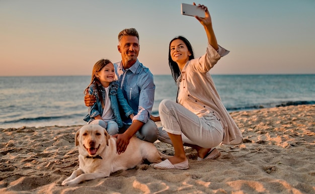 Family with dog on the beach