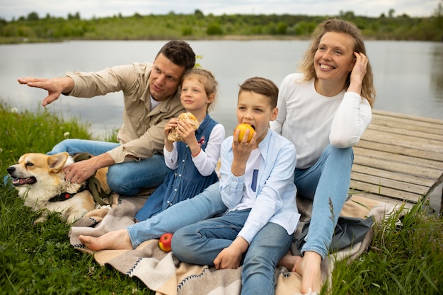 Photo family with dog outdoors