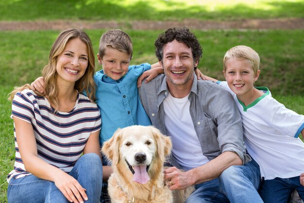 family with dog in the park