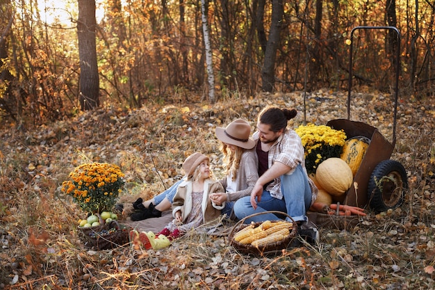 Family with a harvest on a walk in the autumn