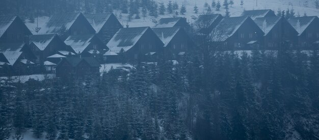 family with snowboards at winter resort