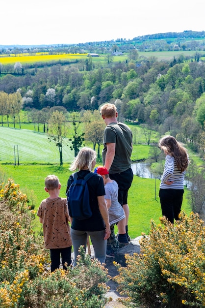 Family with three children on a walk in a mountainous area