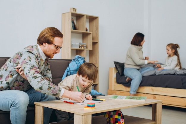 Family with two kids having fun together at home