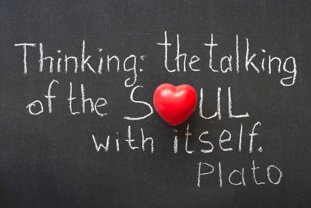 famous ancient greek philosopher plato quote interpretation handwritten on blackboard