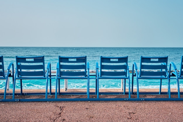 Famous blue chairs on beach of nice france