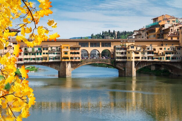 Famous bridge Ponte Vecchio over river Arno at fall day, Florence, Italy