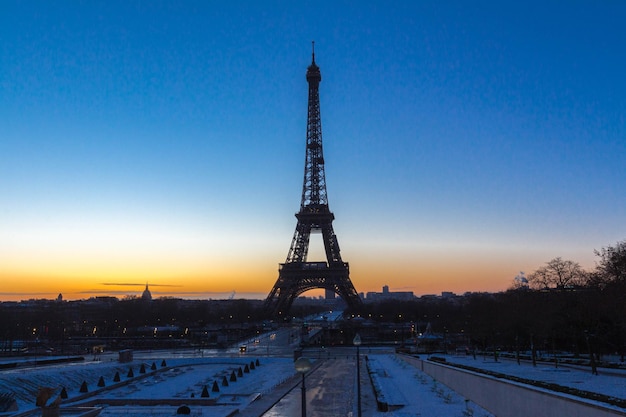 The famous Eiffel tower at sunset in winter Paris